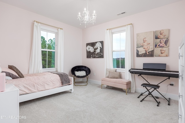 819 NW Morgan Rd, Charleston, TN 37310 - carpeted bedroom with a chandelier and baseboards