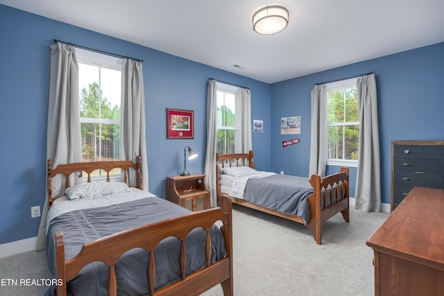 819 NW Morgan Rd, Charleston, TN 37310 - bedroom with carpet flooring and baseboards