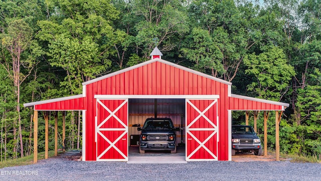 819 NW Morgan Rd, Charleston, TN 37310 - view of pole building with a forest view