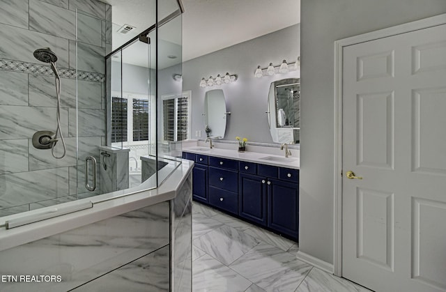 full bath featuring marble finish floors, a shower stall, double vanity, and a bath