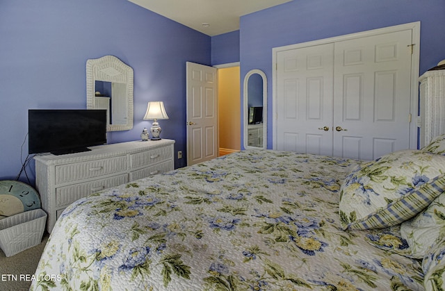 carpeted bedroom with a closet