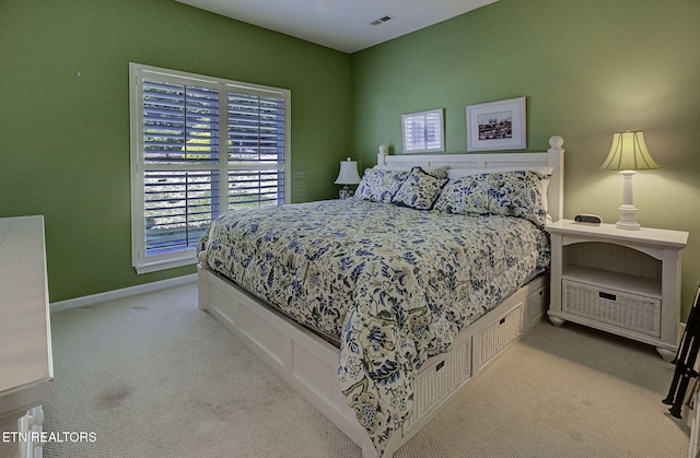 carpeted bedroom with baseboards