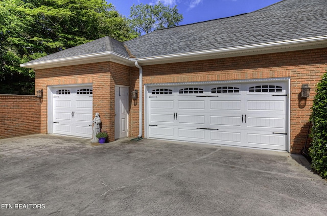 garage featuring driveway
