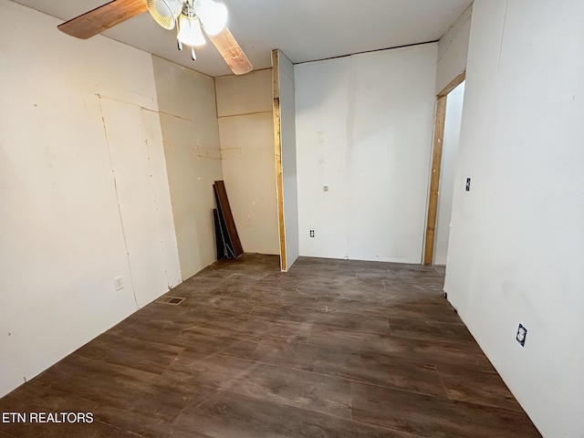 spare room featuring a ceiling fan and wood finished floors