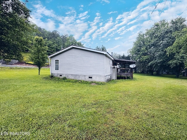 view of property exterior featuring crawl space and a lawn