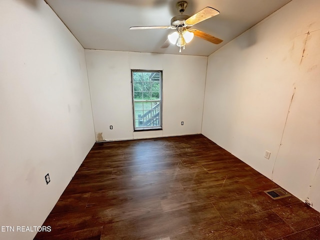 spare room with a ceiling fan and wood finished floors