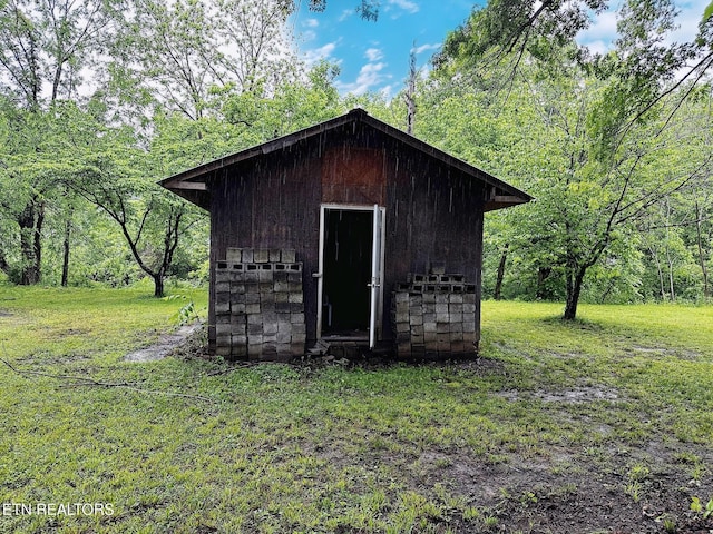 view of shed featuring a forest view