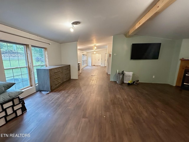 unfurnished living room featuring dark wood-style floors