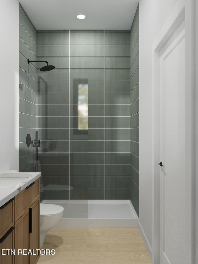 7814 S Northshore Dr, Knoxville, TN 37919 - bathroom featuring toilet, a tile shower, vanity, and recessed lighting