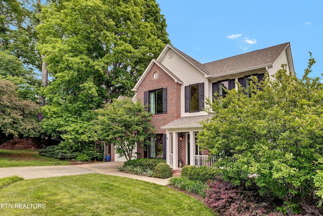 714 Cambridge Crest Ln, Knoxville, TN 37919 - view of front of house featuring brick siding, concrete driveway, a front lawn, and a shingled roof