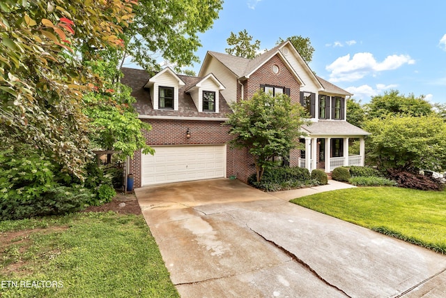 714 Cambridge Crest Ln, Knoxville, TN 37919 - traditional-style house featuring brick siding, driveway, a front yard, and a garage