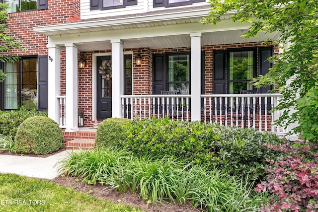 714 Cambridge Crest Ln, Knoxville, TN 37919 - doorway to property featuring brick siding and a porch