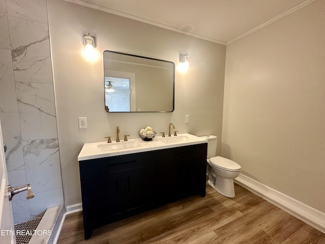 full bath featuring wood finished floors, crown molding, toilet, double vanity, and a shower