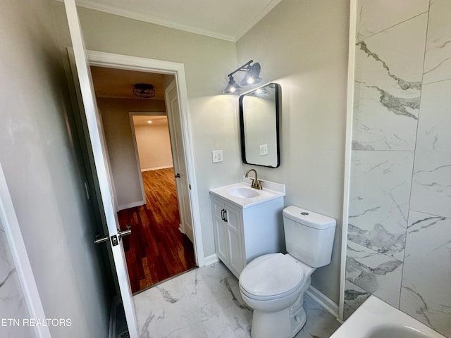 bathroom featuring marble look tile flooring, toilet, vanity, crown molding, and baseboards