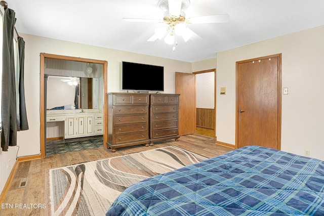 8000 Berkshire Blvd, Powell, TN 37849 - bedroom featuring wood finished floors, baseboards, ceiling fan, and ensuite bathroom