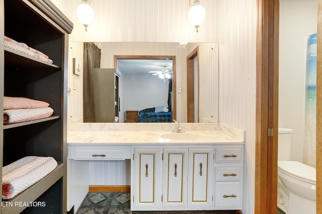 8000 Berkshire Blvd, Powell, TN 37849 - bathroom with connected bathroom, vanity, toilet, and ceiling fan