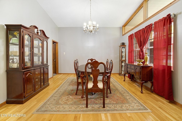 8000 Berkshire Blvd, Powell, TN 37849 - dining space featuring a chandelier, light wood-type flooring, and vaulted ceiling