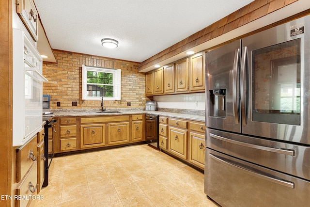 8000 Berkshire Blvd, Powell, TN 37849 - kitchen featuring stainless steel fridge with ice dispenser, a sink, brown cabinets, a textured ceiling, and light tile patterned flooring