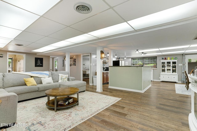 8000 Berkshire Blvd, Powell, TN 37849 - living area with dark wood-type flooring, baseboards, plenty of natural light, and a paneled ceiling