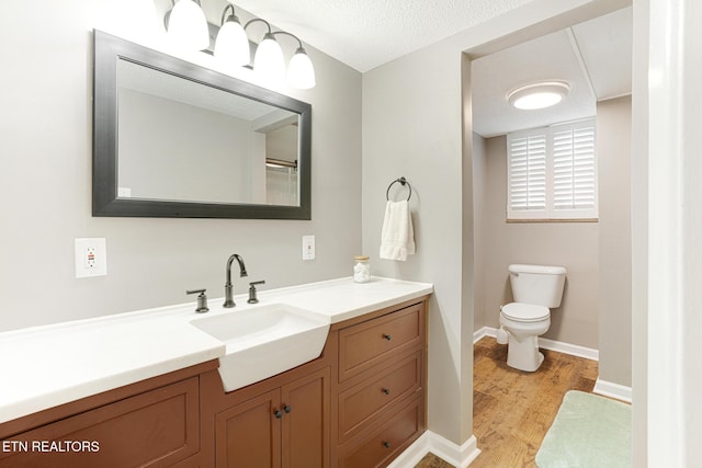 8000 Berkshire Blvd, Powell, TN 37849 - full bathroom featuring wood finished floors, toilet, vanity, and baseboards