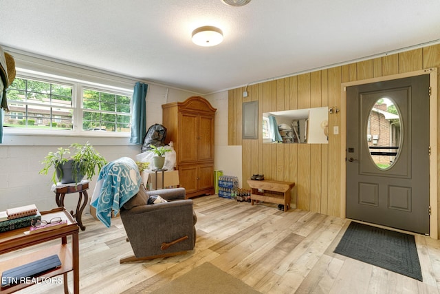 8000 Berkshire Blvd, Powell, TN 37849 - sitting room featuring light wood-type flooring, wood walls, and crown molding