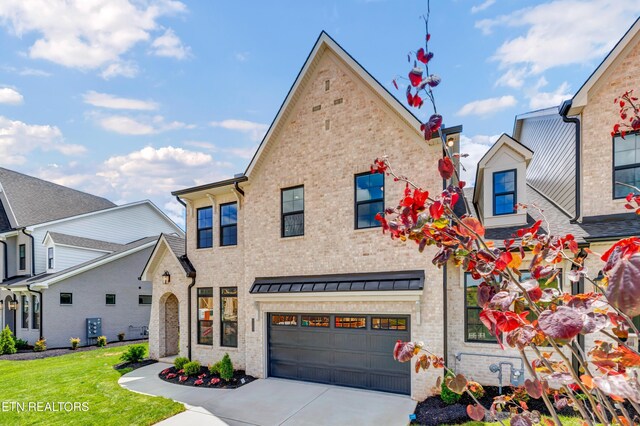 1123 Branch Hook Rd, Knoxville, TN 37934 - view of front of property with driveway, brick siding, and a garage