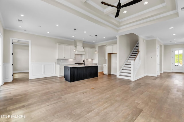 1123 Branch Hook Rd, Knoxville, TN 37934 - kitchen with custom exhaust hood, ceiling fan, an island with sink, open floor plan, and white cabinetry