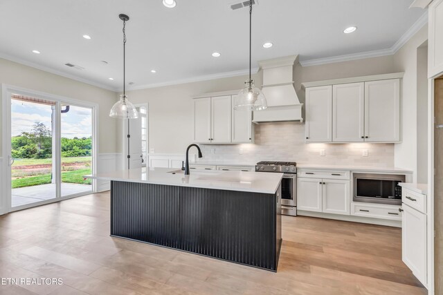 1123 Branch Hook Rd, Knoxville, TN 37934 - kitchen with gas range, a sink, premium range hood, built in microwave, and light countertops
