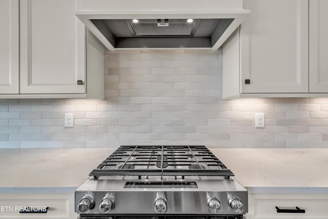 1123 Branch Hook Rd, Knoxville, TN 37934 - kitchen with custom exhaust hood, white cabinets, stove, tasteful backsplash, and light stone counters