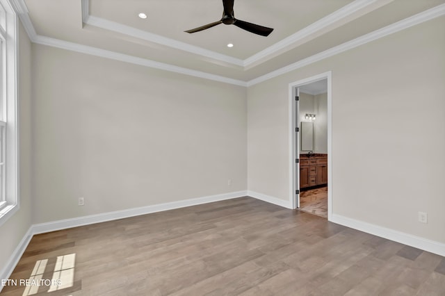 1123 Branch Hook Rd, Knoxville, TN 37934 - empty room with a ceiling fan, wood finished floors, a tray ceiling, crown molding, and baseboards