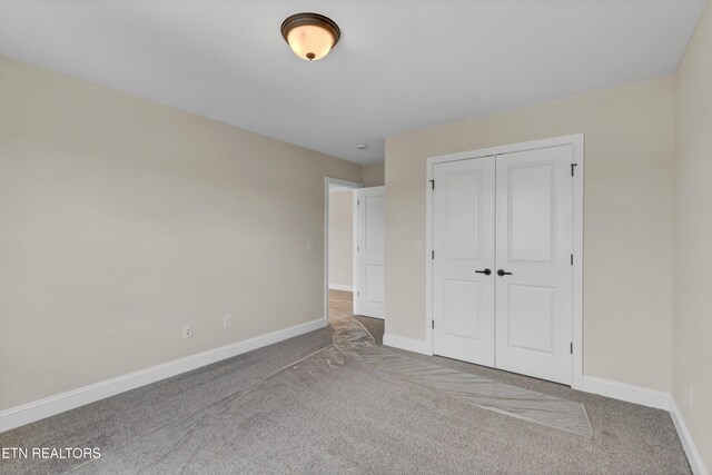 1123 Branch Hook Rd, Knoxville, TN 37934 - unfurnished bedroom featuring carpet floors, baseboards, and a closet