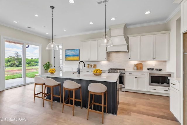 1123 Branch Hook Rd, Knoxville, TN 37934 - kitchen featuring stainless steel gas stove, custom range hood, a sink, black microwave, and a breakfast bar area