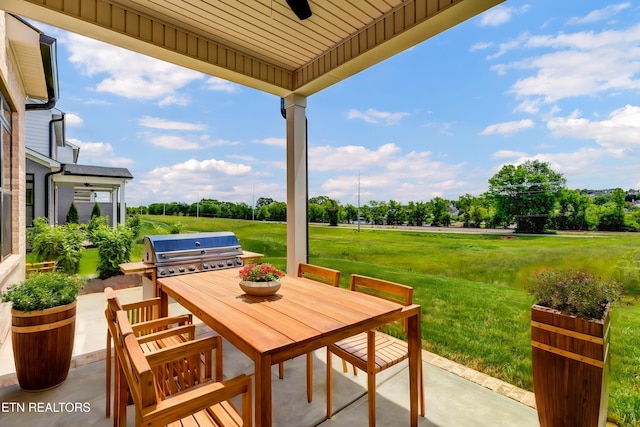 1123 Branch Hook Rd, Knoxville, TN 37934 - view of patio / terrace featuring area for grilling, a ceiling fan, outdoor dining space, and view of scattered trees