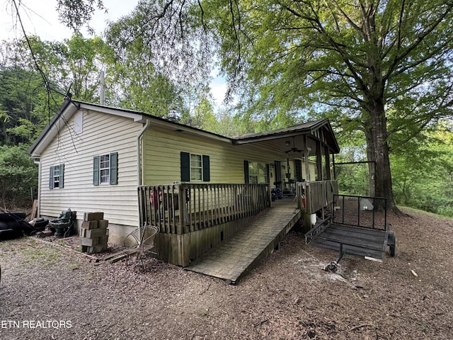 3441 Glendale Rd, Bybee, TN 37713 - view of home's exterior featuring a deck and ceiling fan
