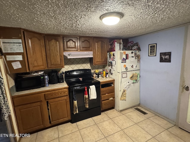 3441 Glendale Rd, Bybee, TN 37713 - kitchen with black appliances, under cabinet range hood, tile counters, light tile patterned flooring, and tasteful backsplash