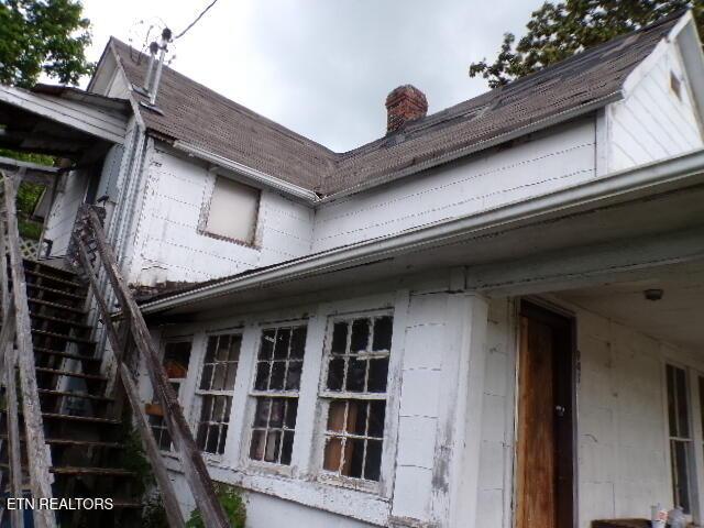 941 Unaka St, Harriman, TN 37748 - view of side of home with stairway and a chimney
