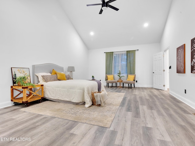 bedroom featuring high vaulted ceiling, wood finished floors, baseboards, recessed lighting, and a ceiling fan