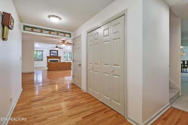 11 Kingsboro Ln, Crossville, TN 38558 - corridor with light wood-type flooring, baseboards, and a textured ceiling
