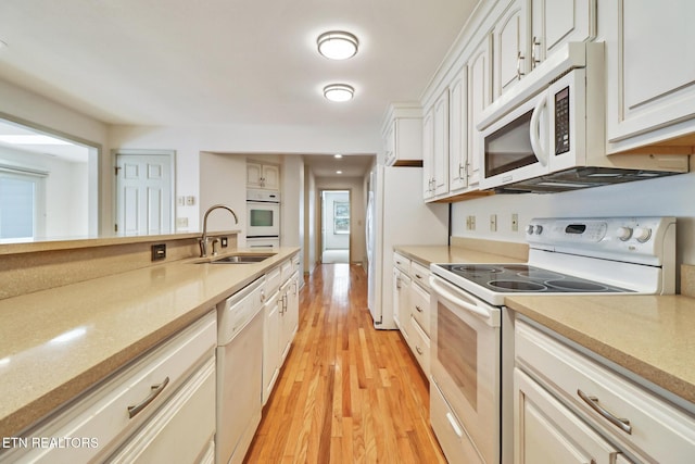 11 Kingsboro Ln, Crossville, TN 38558 - kitchen with white appliances, a sink, and light countertops