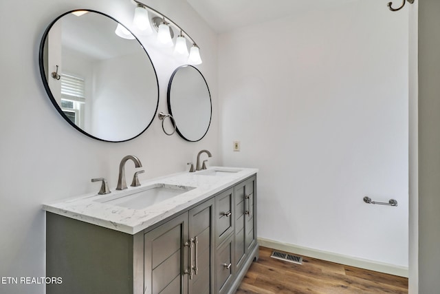 11 Kingsboro Ln, Crossville, TN 38558 - bathroom with wood finished floors, double vanity, and baseboards