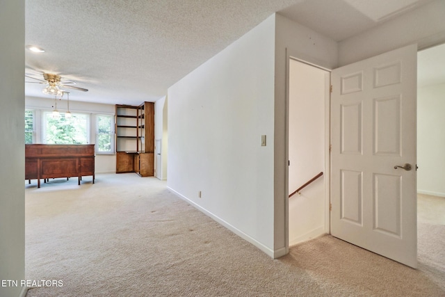 11 Kingsboro Ln, Crossville, TN 38558 - hall featuring carpet, an upstairs landing, baseboards, and a textured ceiling