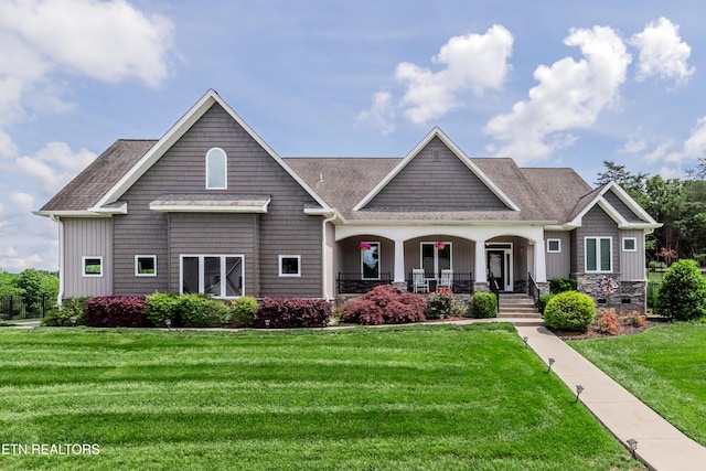 109 Niwodihi Trl, Vonore, TN 37885 - craftsman house with a porch, a front yard, and a shingled roof