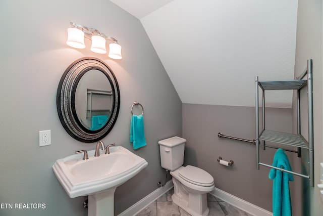 109 Niwodihi Trl, Vonore, TN 37885 - bathroom featuring lofted ceiling, marble finish flooring, toilet, a sink, and baseboards