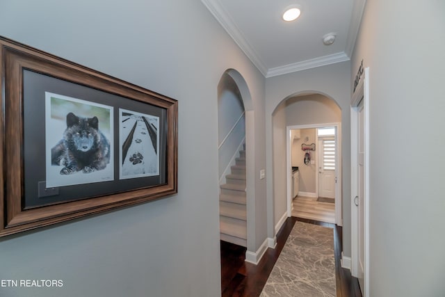 109 Niwodihi Trl, Vonore, TN 37885 - hallway featuring crown molding, dark wood-type flooring, baseboards, stairway, and arched walkways