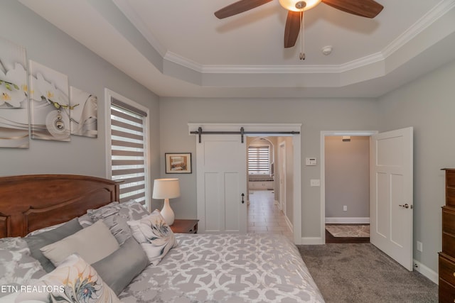 109 Niwodihi Trl, Vonore, TN 37885 - bedroom featuring a barn door, crown molding, carpet, a tray ceiling, and ceiling fan