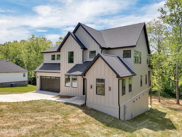 1715 Serene Cove Way, Knoxville, TN 37920 - modern farmhouse with board and batten siding, driveway, an attached garage, and central AC