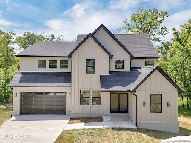 1715 Serene Cove Way, Knoxville, TN 37920 - modern farmhouse style home featuring roof with shingles, board and batten siding, driveway, and a garage