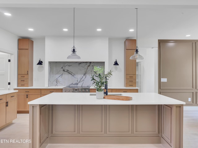 1715 Serene Cove Way, Knoxville, TN 37920 - kitchen featuring light countertops, tasteful backsplash, recessed lighting, a center island with sink, and decorative light fixtures