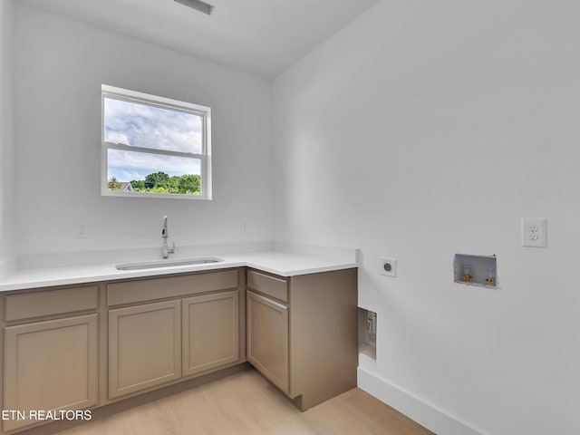 1715 Serene Cove Way, Knoxville, TN 37920 - washroom featuring hookup for an electric dryer, washer hookup, light wood-style floors, baseboards, and cabinet space