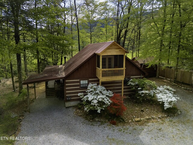 3364 Rocky Ridge Rd, Cosby, TN 37722 - view of side of property with stairway, fence, a view of trees, and driveway